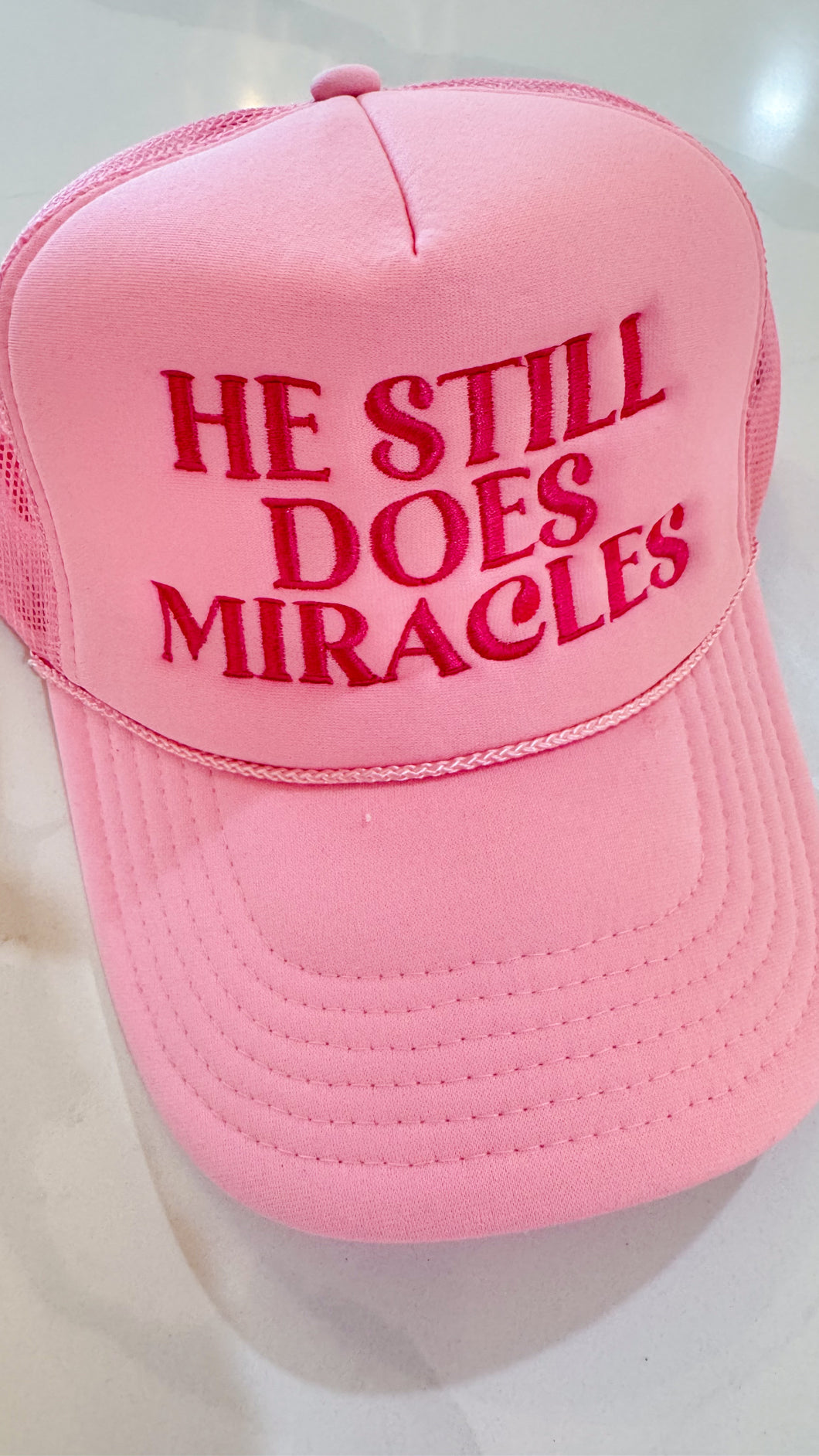 He Does Miracles Trucker Hat